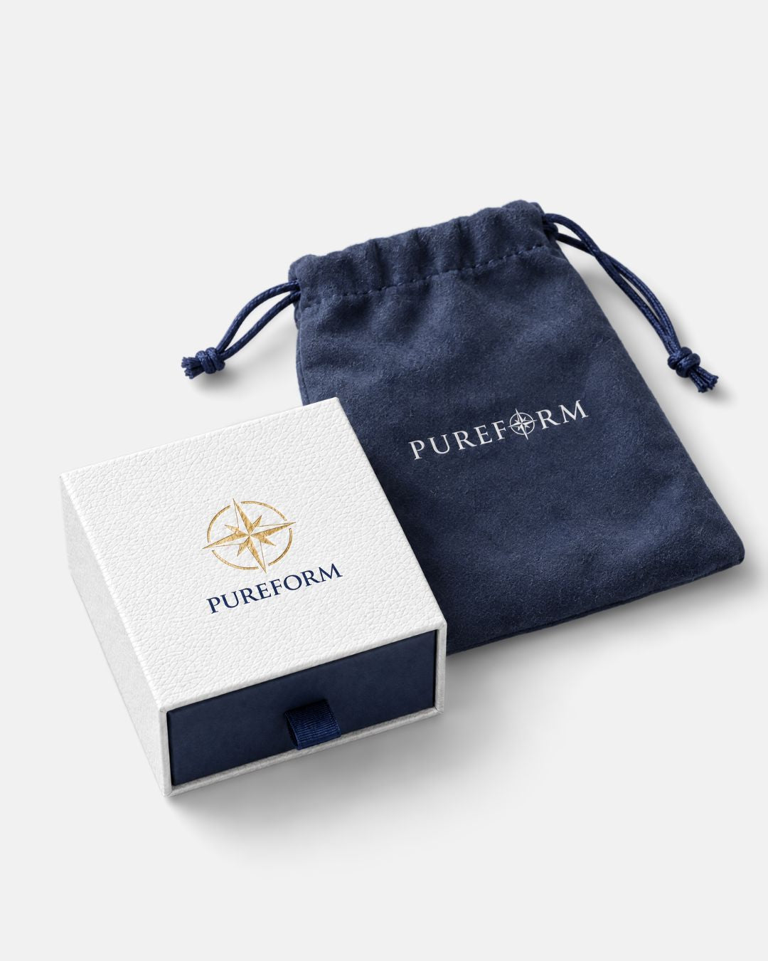 Navy velvet Pureform pouch next to the Pureform gift box