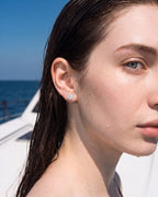 Silver moissanite stud worn on the ear