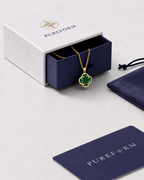 Pureform charm necklace, malachite green clover with a polished gold finish