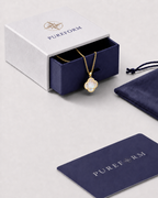 Pureform charm necklace, nacre white clover with a polished gold finish