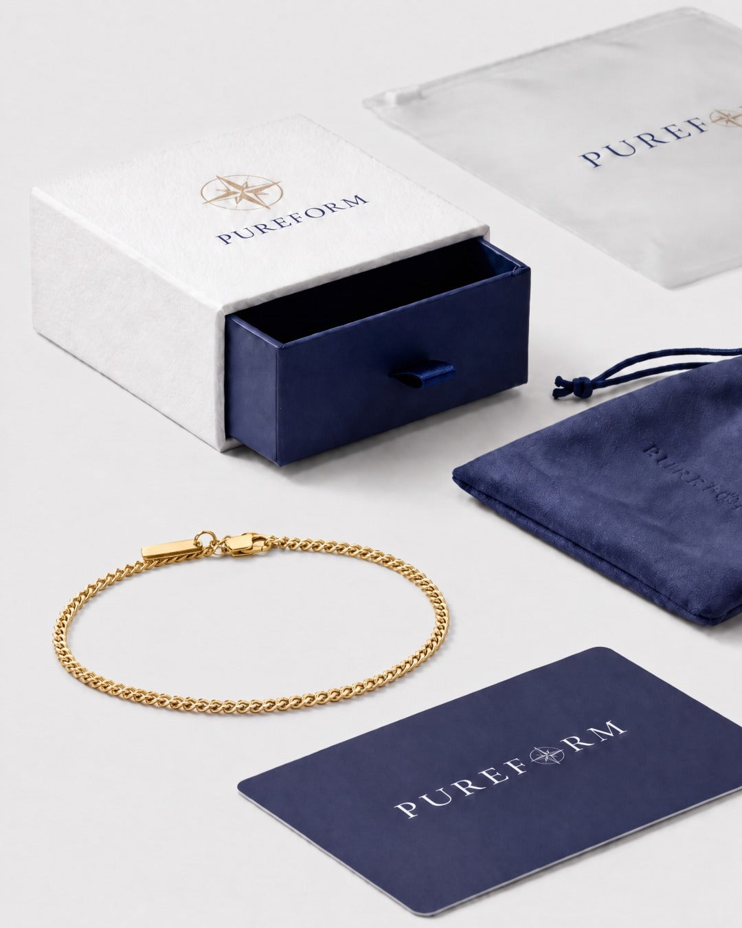 Gold Cuban tag bracelet with Pureform gift box, pouch and card