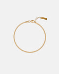 Pureform Fine Cuban Bracelet in 18K gold, delicate Cuban chain with tiny bar tag, top view