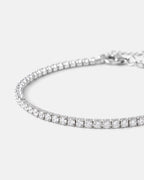 Close-up of the fine silver prong-set stones and lobster clasp of the Fine Tennis Bracelet