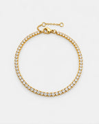 Pureform Fine Tennis Bracelet in 18K gold with clear round-cut stones, top view