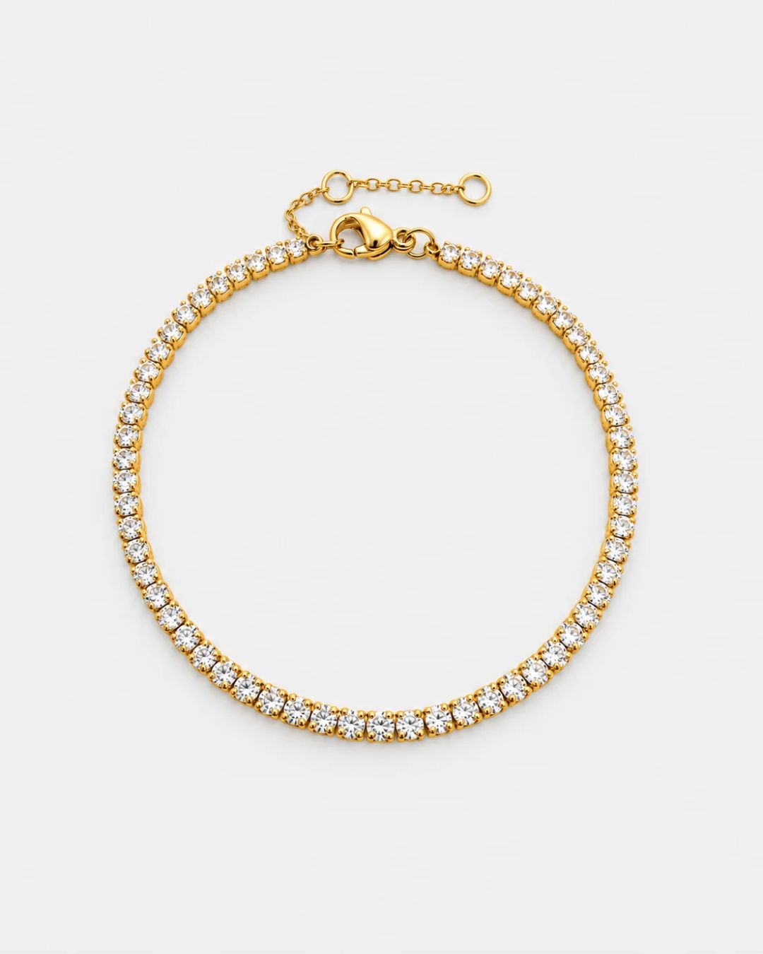 Pureform Fine Tennis Bracelet in 18K gold with clear round-cut stones, top view