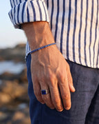 Square-cut sapphire blue zirconia stone set in a polished titanium steel ring