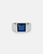 Strong, lightweight titanium steel ring with a rich sapphire-blue centre stone
