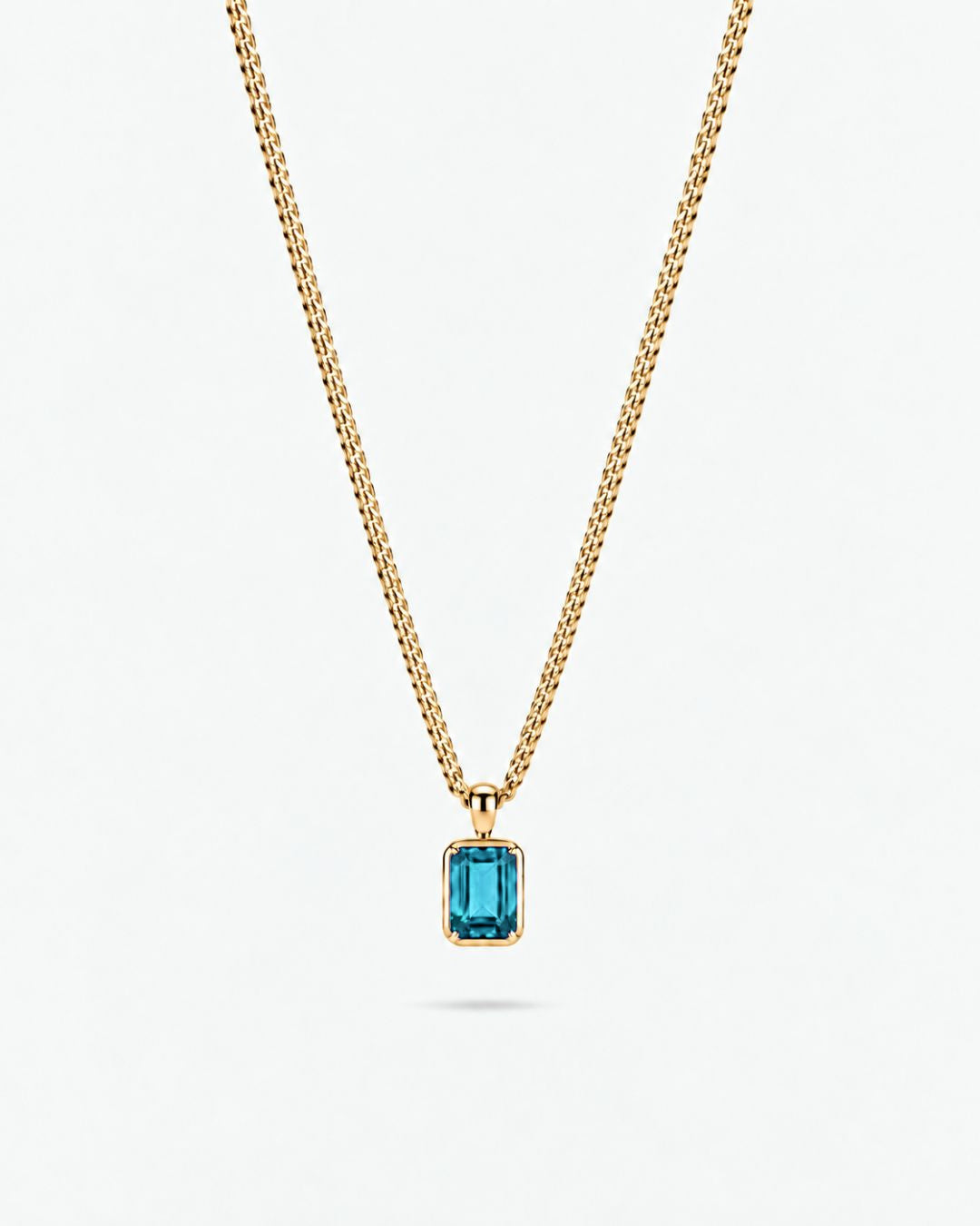 Aquamarine pendant necklace, 1 carat, 18K gold — studio packshot on white