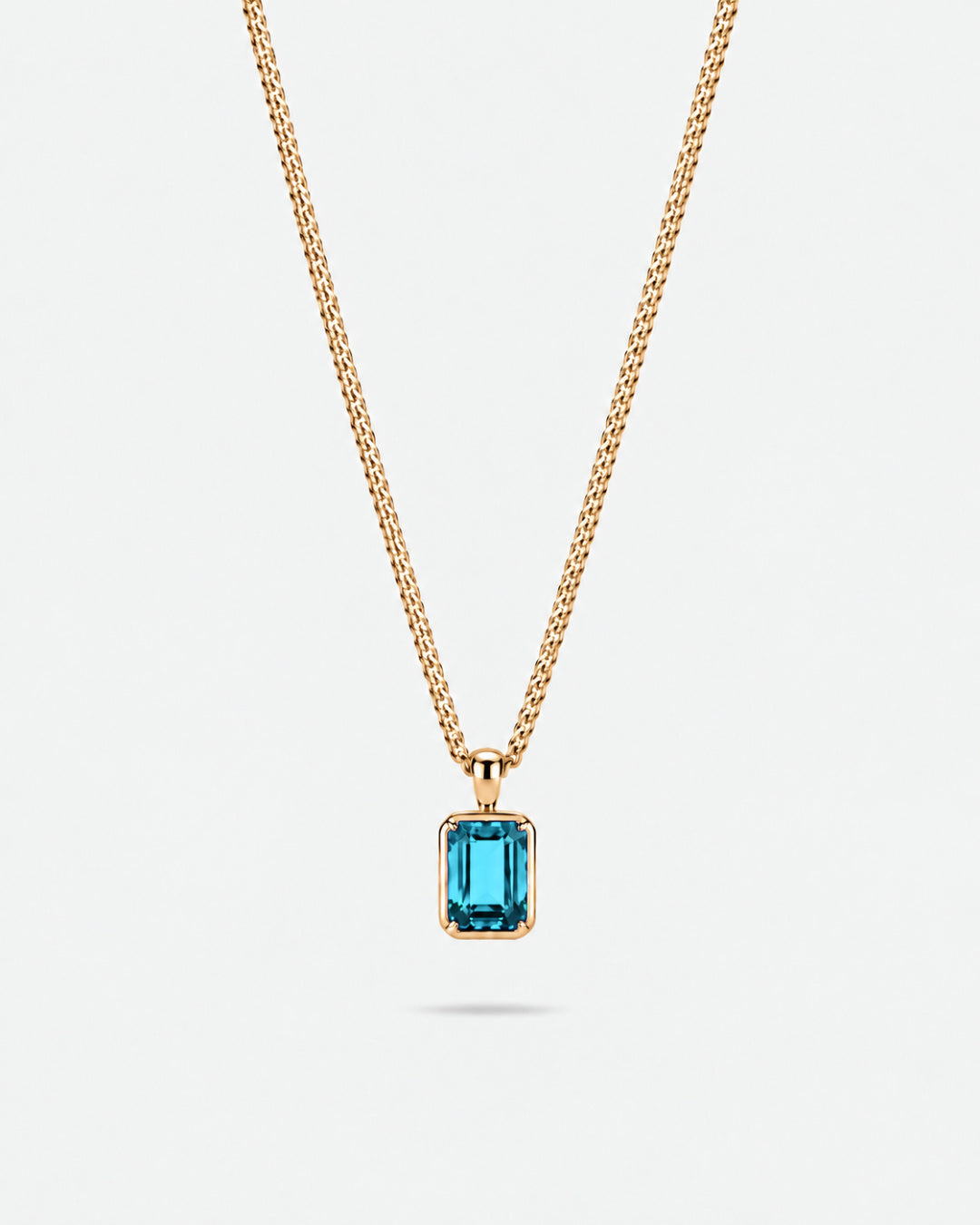 Aquamarine pendant necklace, 2 carat, 18K gold — studio packshot on white