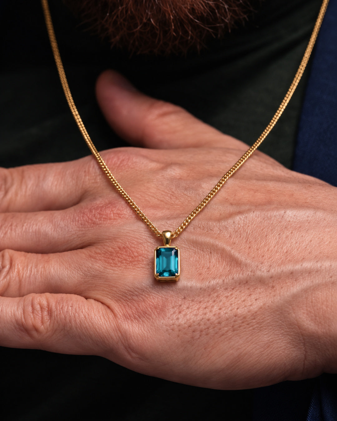 Aquamarine pendant necklace, 3 carat, 18K gold — shown in hand for scale