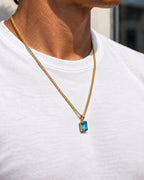 Aquamarine pendant necklace, 3 carat, 18K gold — worn with a white tee