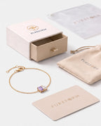 June birthstone bracelet in 14K gold, light amethyst and clear crystal stones with Pureform gift packaging