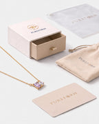 June birthstone necklace in 14K gold, light amethyst and clear crystal stones with Pureform gift packaging
