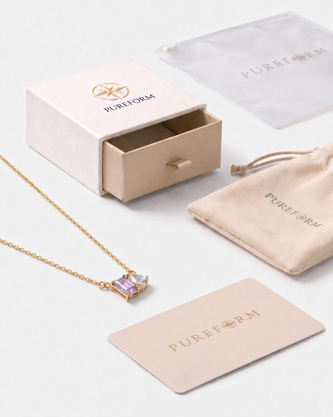 June birthstone necklace in 14K gold, light amethyst and clear crystal stones with Pureform gift packaging
