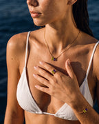 August birthstone ring, bracelet and necklace set in 14K gold, worn