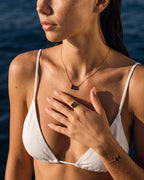 January birthstone ring, bracelet and necklace set in 14K gold, worn