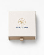 Pureform ivory gift box seen from above with gold foil compass emblem