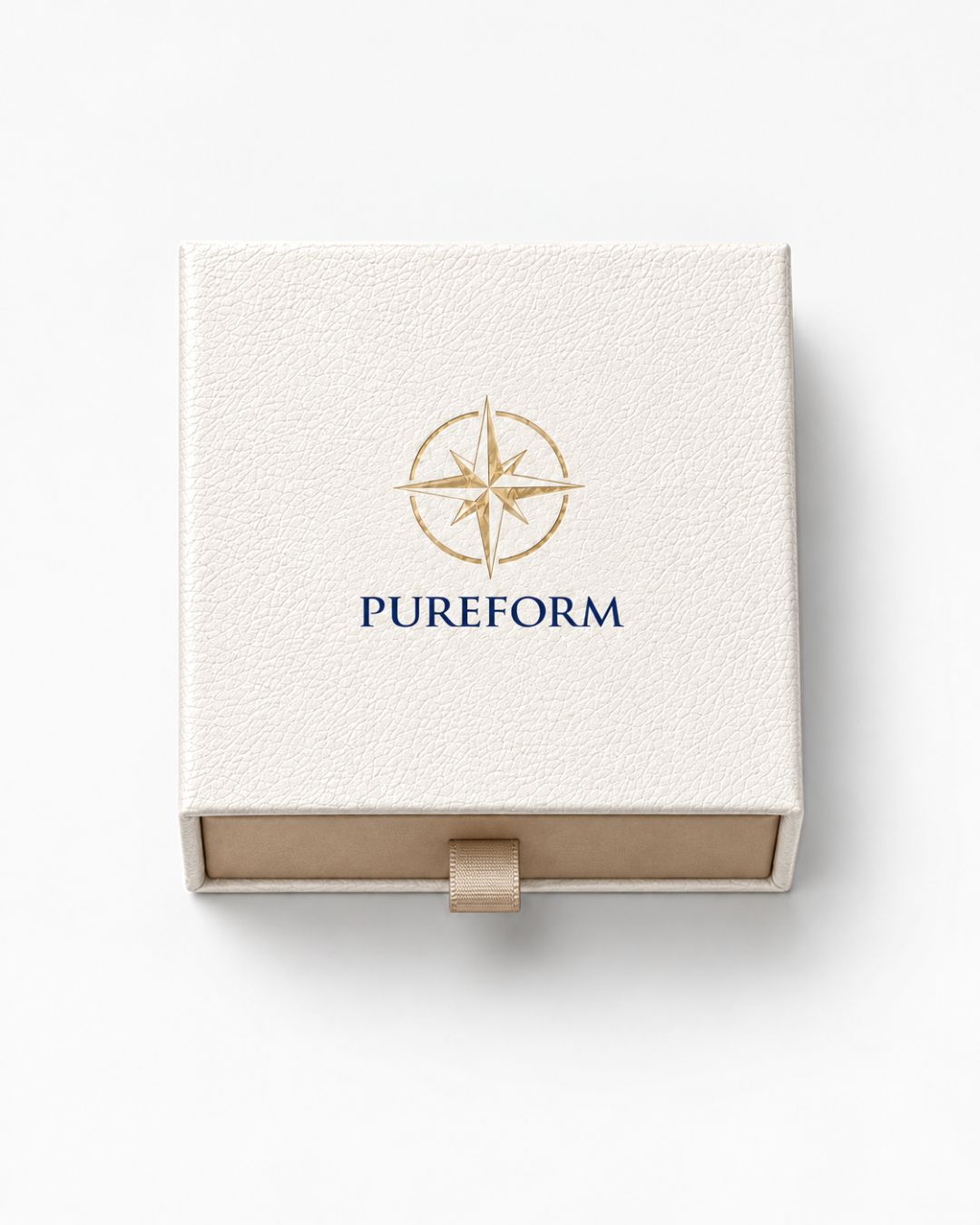 Pureform ivory gift box seen from above with gold foil compass emblem