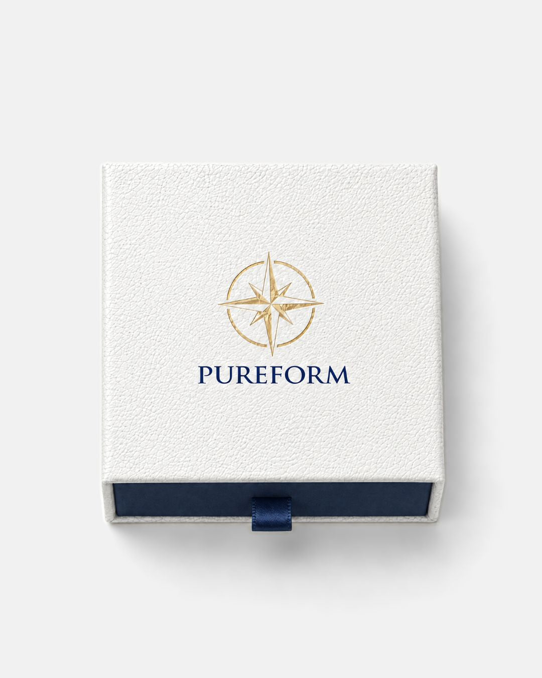 Pureform gift box seen from above with gold foil compass emblem