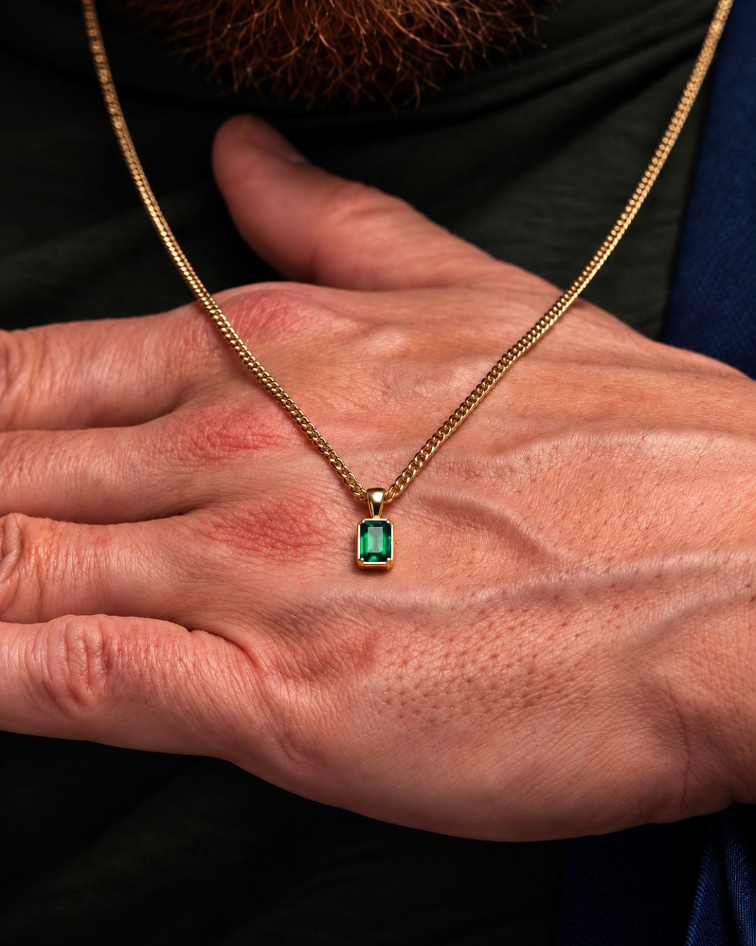 Emerald pendant necklace, 1 carat, 18K gold — shown in hand for scale