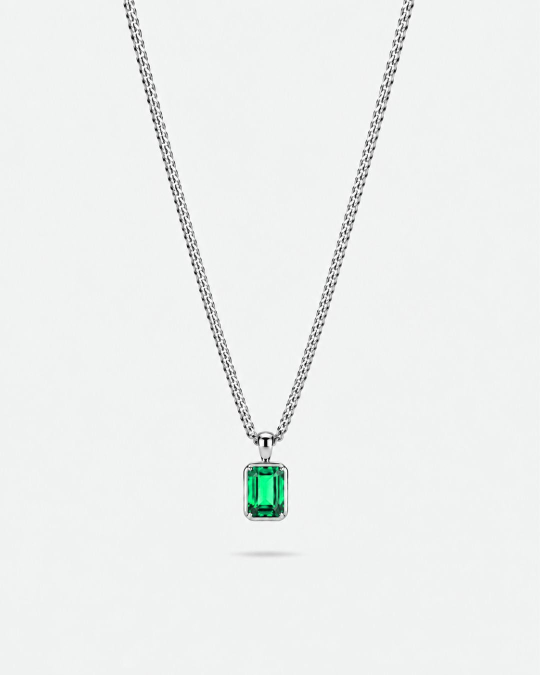 Emerald pendant necklace, 1 carat, 925 silver — studio packshot on white
