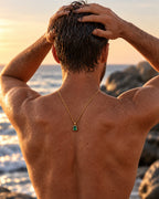 Emerald pendant necklace, 3 carat, 18K gold — worn, seen from behind