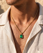 Emerald pendant necklace, 3 carat, 18K gold — worn with an open linen shirt