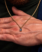 Grey Spinel pendant necklace, 1 carat, 18K gold — shown in hand for scale