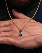 Grey Spinel pendant necklace, 3 carat, 18K gold — shown in hand for scale