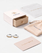 Lumière huggies in citrine silver with Pureform jewelry packaging