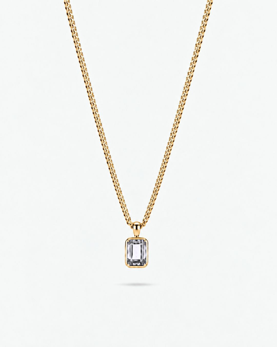 Moissanite pendant necklace, 1 carat, 18K gold — studio packshot on white