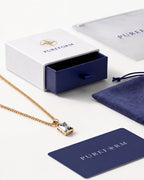 Moissanite pendant necklace, 2 carat, 18K gold — shown with Pureform packaging