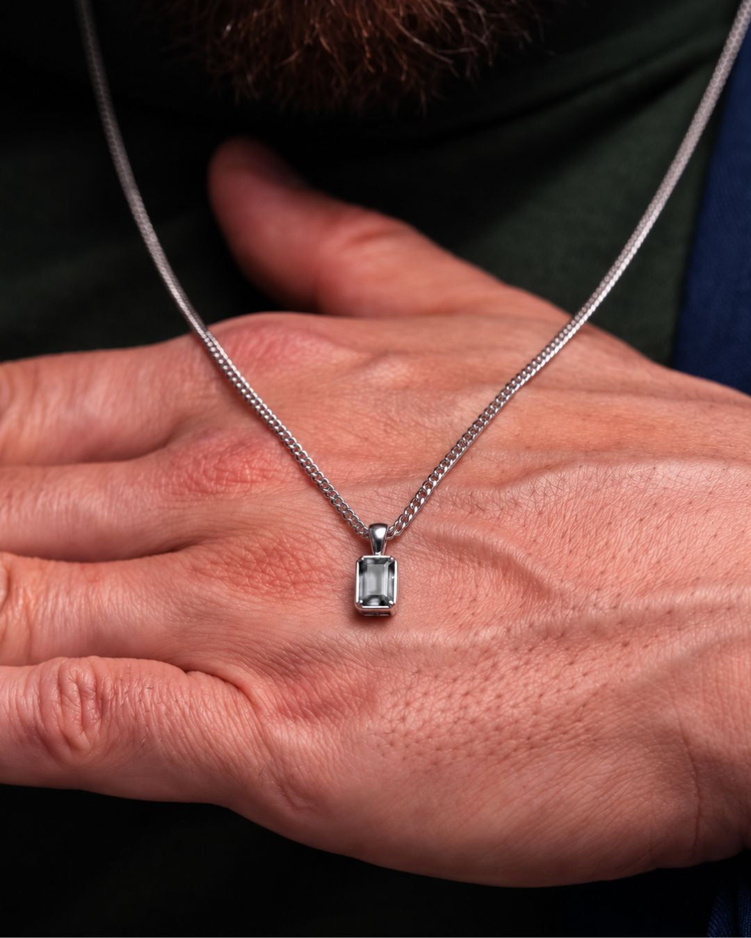 Moissanite pendant necklace, 2 carat, 925 silver — shown in hand for scale