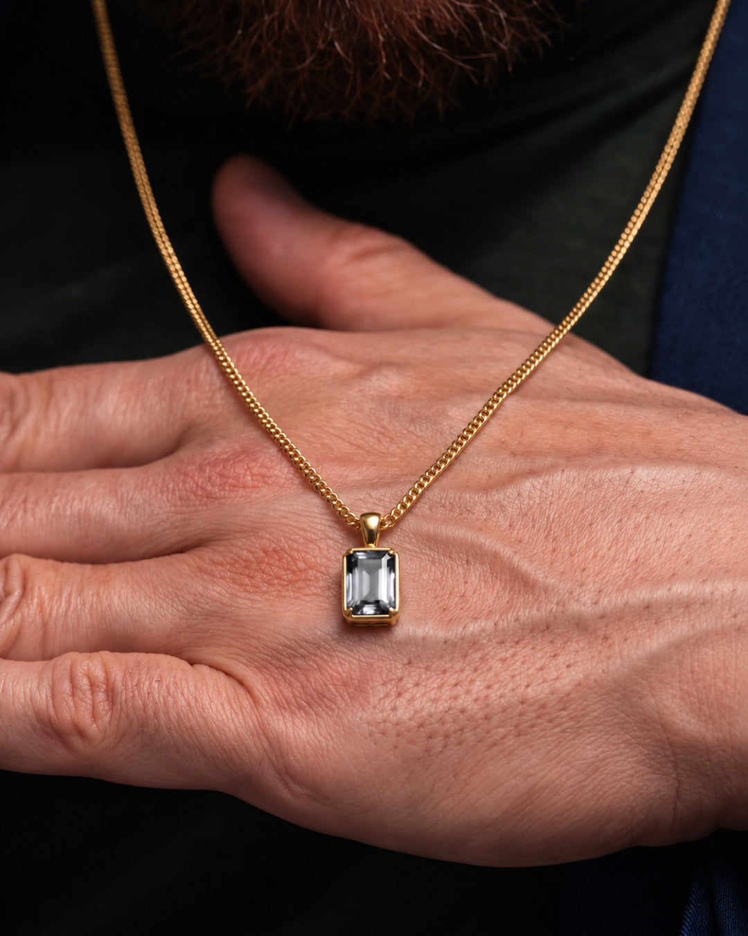 Moissanite pendant necklace, 3 carat, 18K gold — shown in hand for scale