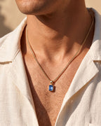 Royal Blue pendant necklace, 1 carat, 18K gold — worn with an open linen shirt