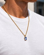 Royal Blue pendant necklace, 3 carat, 18K gold — worn with a white tee