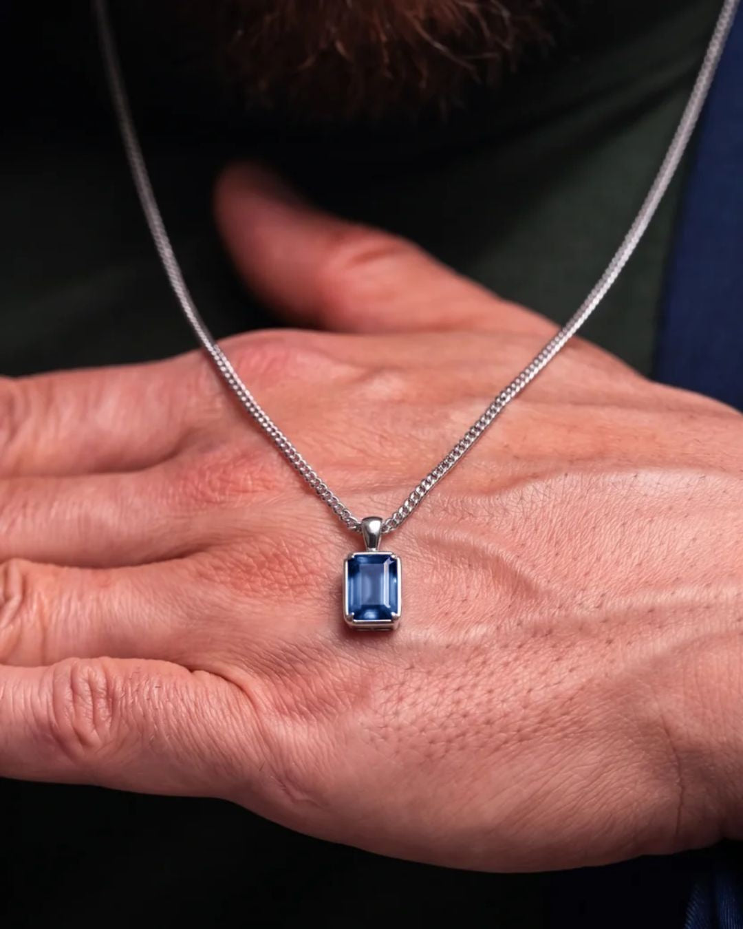 Royal Blue pendant necklace, 3 carat, 925 silver — shown in hand for scale