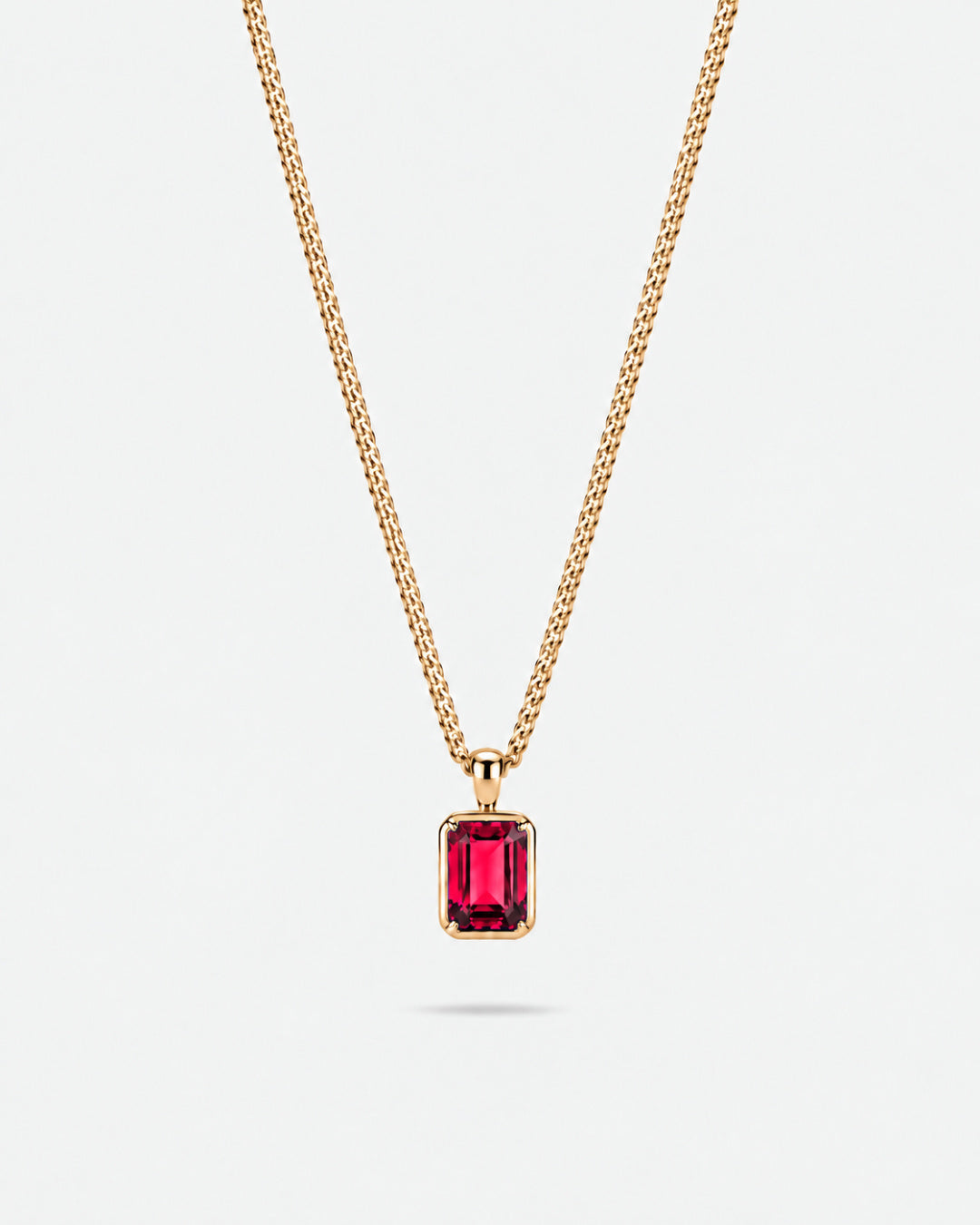 Ruby pendant necklace, 2 carat, 18K gold — studio packshot on white