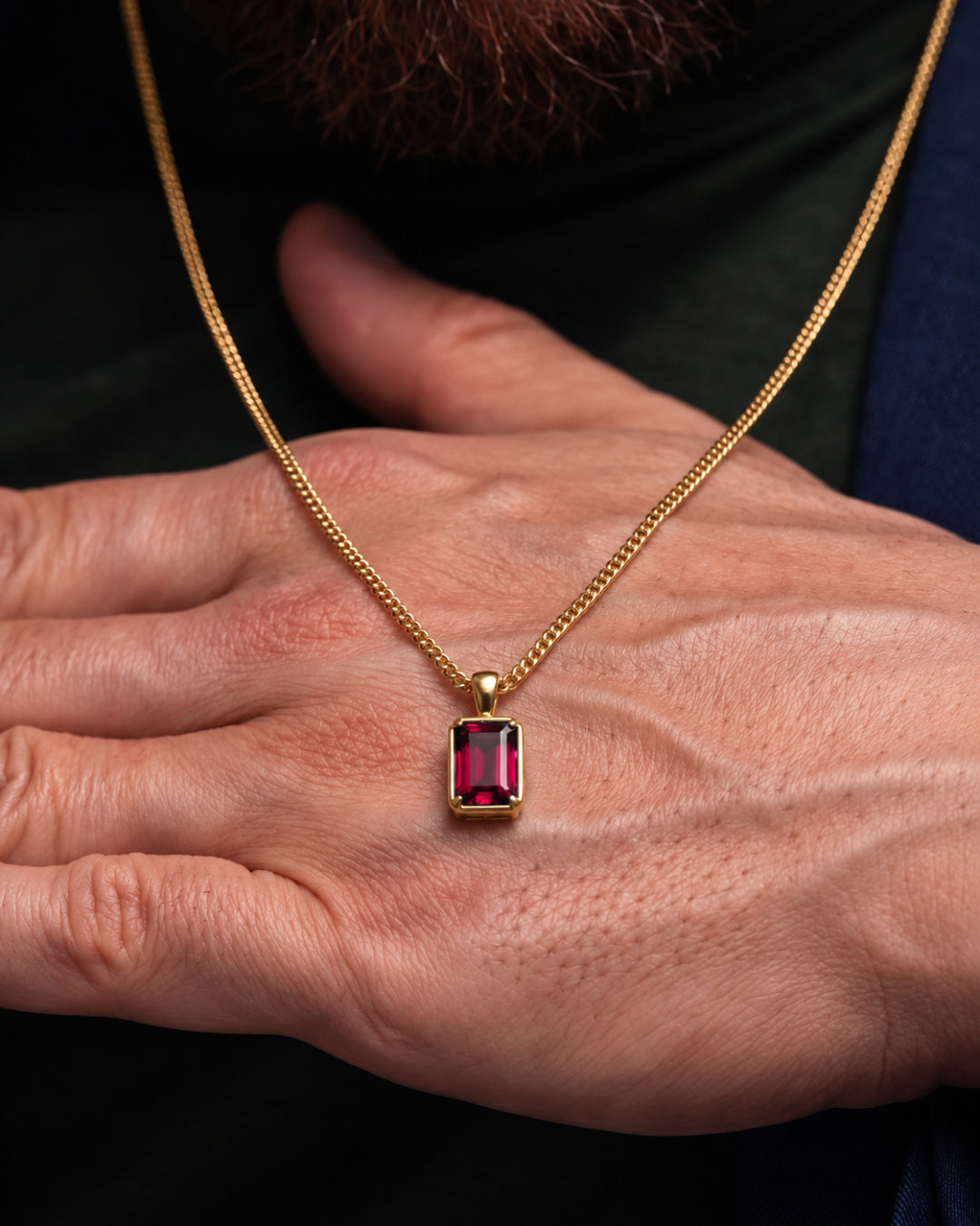 Ruby pendant necklace, 3 carat, 18K gold — shown in hand for scale