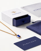 Sapphire pendant necklace, 2 carat, 18K gold — shown with Pureform packaging