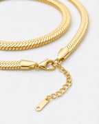 Close-up of the Serpent Flat Necklace in 18K gold showing lobster clasp and extender