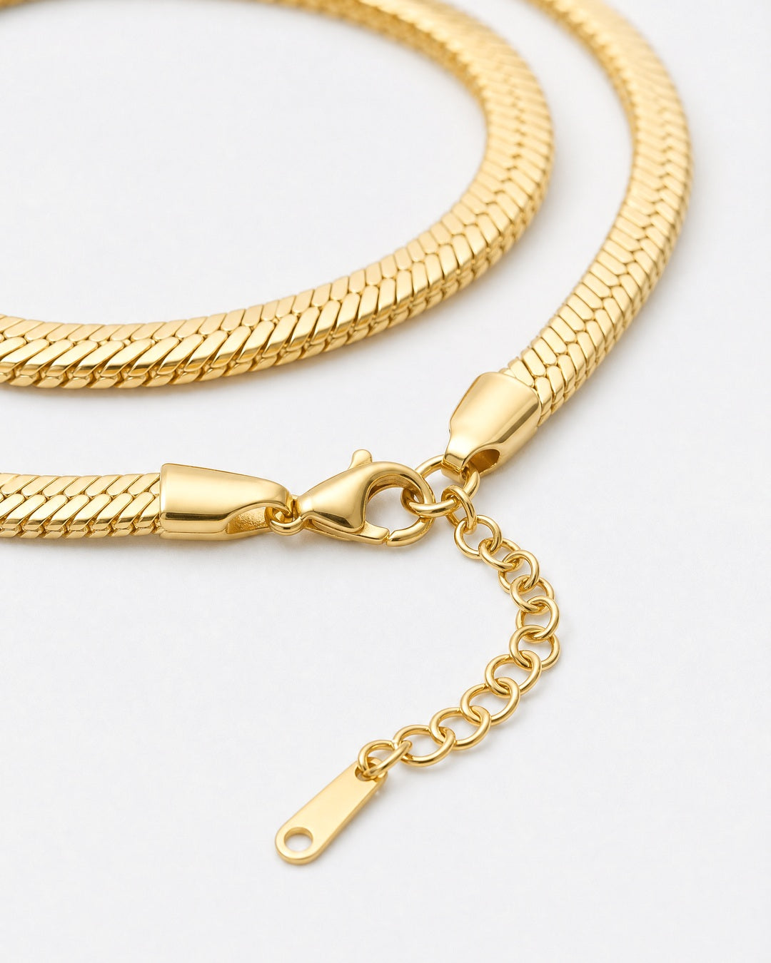 Close-up of the Serpent Flat Necklace in 18K gold showing lobster clasp and extender